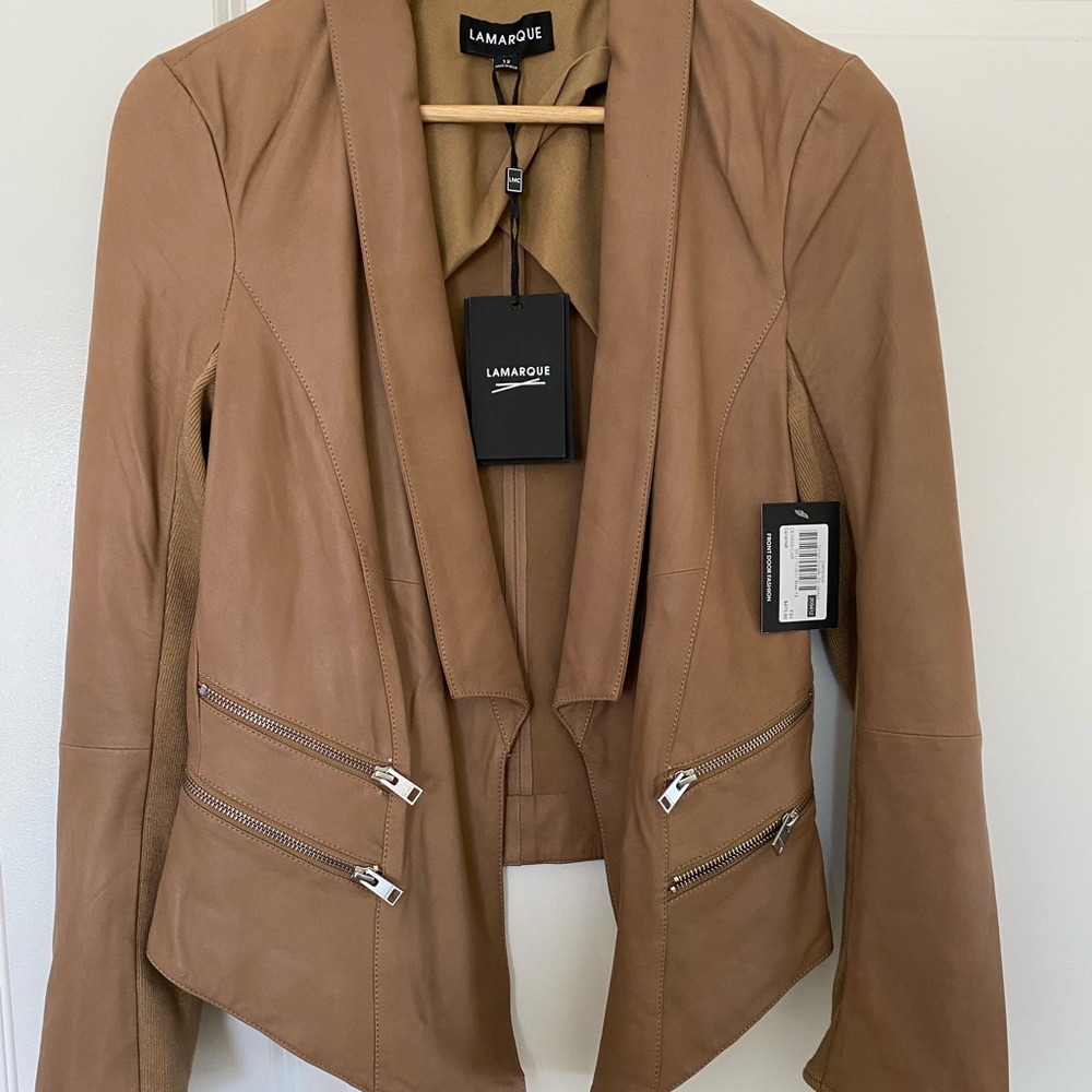 Leather dress jacket. Very soft fitted material on the back sleeve.